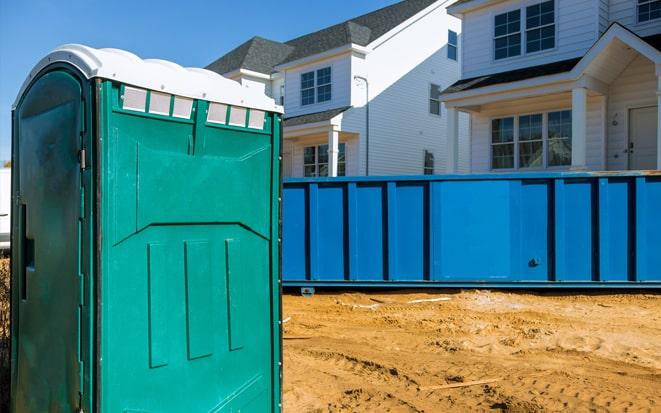 portable toilet and dumpster at a construction site project in Sayreville NJ